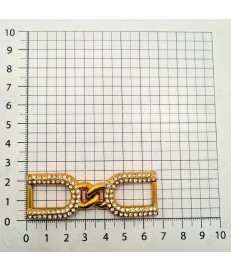 ESTRIBO/TRABILLA PLASTICO 7CM ORO CON STRASS