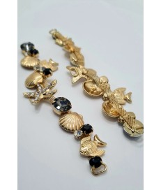 ADORNO STRASS ALARGADO MARINO PECES ESTRELLA MAR ORO / NEGRO (2 UNIDADES)
