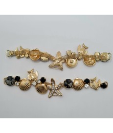 ADORNO STRASS ALARGADO MARINO PECES ESTRELLA MAR ORO / NEGRO (2 UNIDADES)